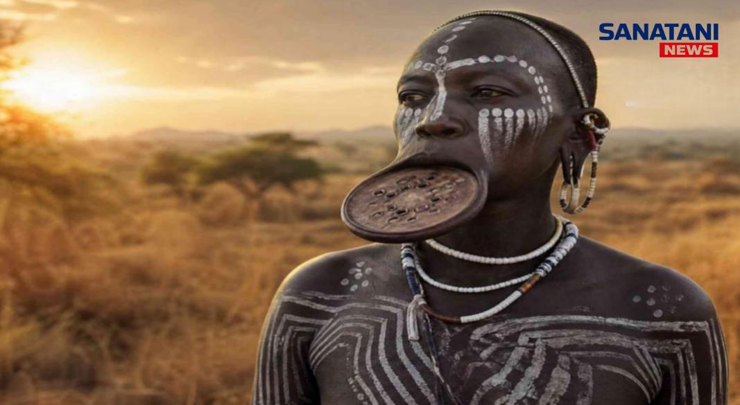 Mursi tribe woman wearing traditional clay lip plate in Omo Valley Ethiopia